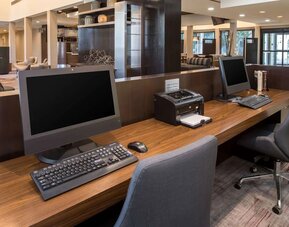 Business center with computers, printer and ergonomic chairs at Sonesta Select Seattle Bellevue Redmond.