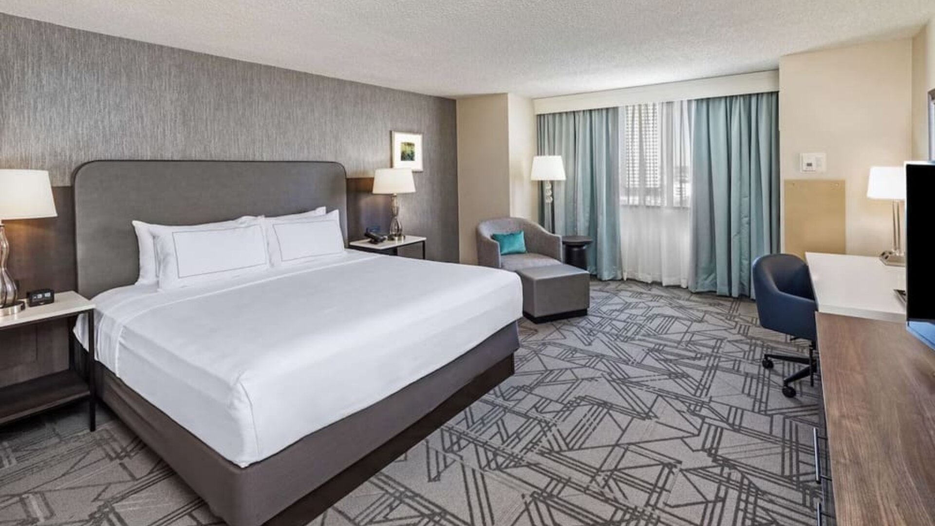 Day use room with work desk at DoubleTree By Hilton Tulsa-Downtown.

