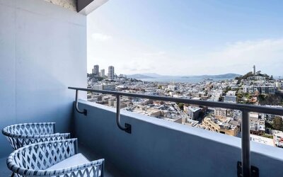 Balcony inside day use room overlooking the city at Hilton San Francisco Financial District.
