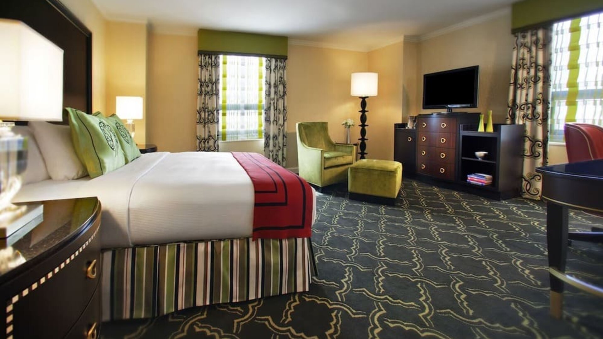 Spacious king suite with work desk and lounger at Palmer House A Hilton Hotel.