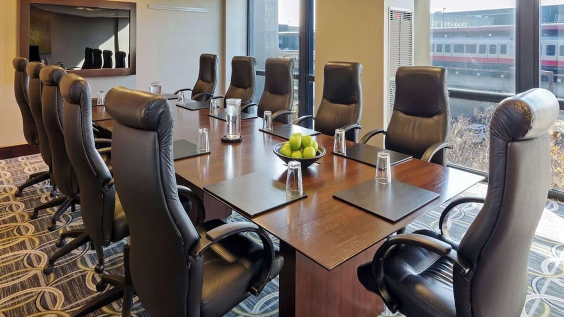 Bright-lit meeting room at Hilton Chicago O'Hare Airport.