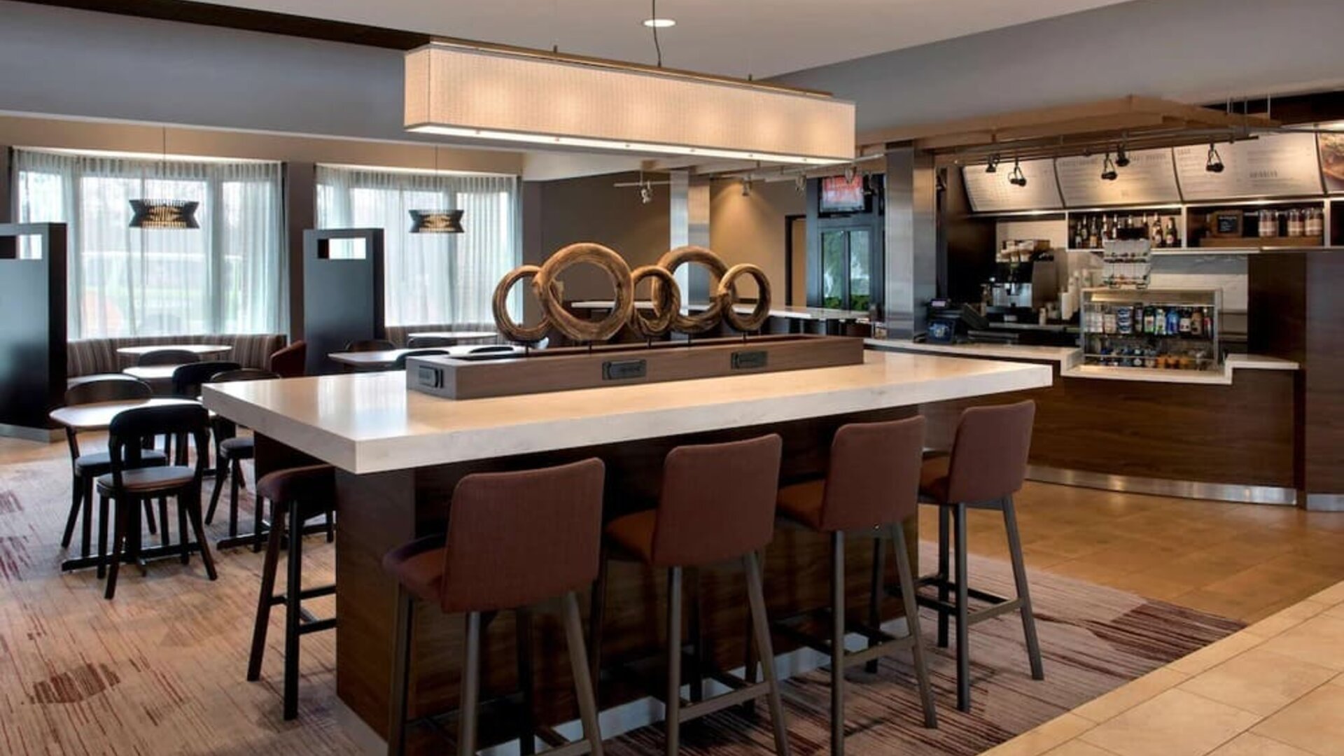 Dining area and workspace at Sonesta Select Boston Milford.