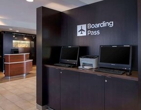 Business center with computers and printer at Sonesta Select Boston Milford.