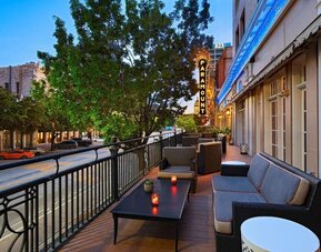 Hotel terrace with lounge seating at The Stephen F Austin Royal Sonesta Hotel