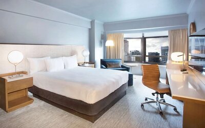 Day use room with work desk and natural light at New York Hilton Midtown.