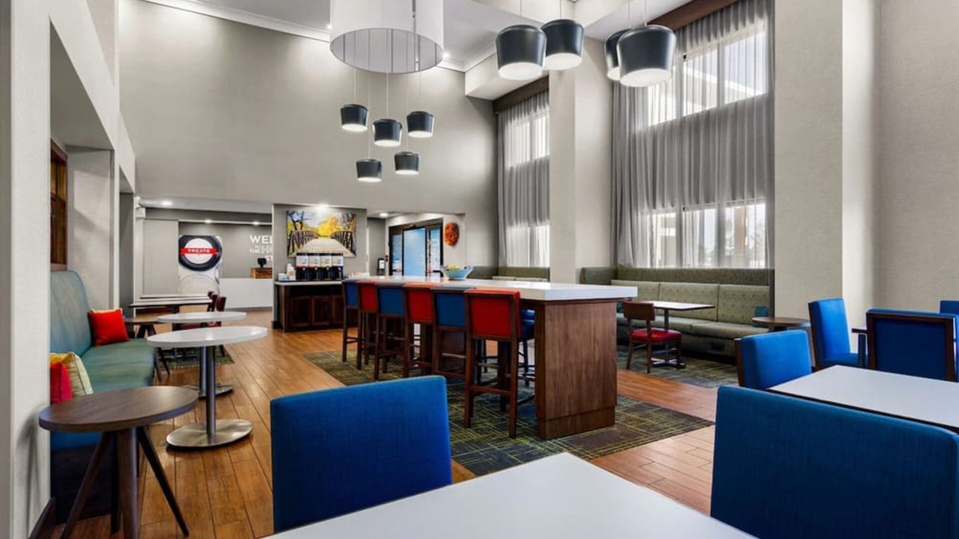 Lobby and coworking lounge at Hampton Inn & Suites Schererville.