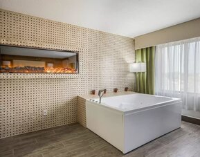 Bath tub inside day use room at The Leo Collection, An Ascend Collection Hotel.