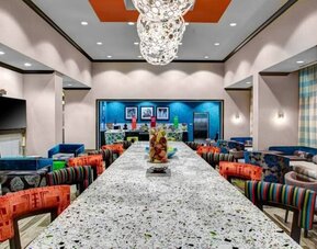 Dining area perfect for coworking at Hampton Inn & Suites By Hilton Atlanta Perimeter Dunwoody.