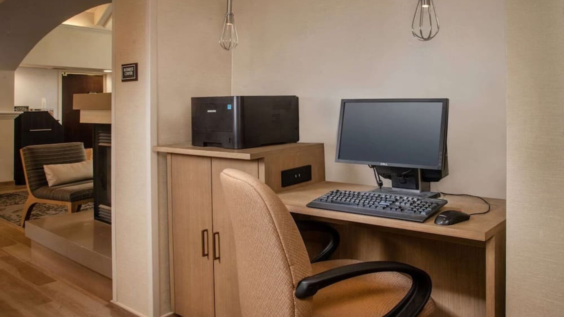 Business center with computer, printer and ergonomic chair at Sonesta ES Suites Baltimore BWI Airport.
