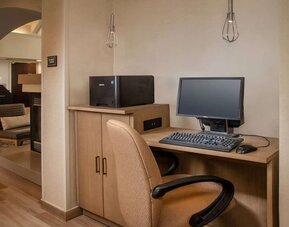 Business center with computer, printer and ergonomic chair at Sonesta ES Suites Baltimore BWI Airport.