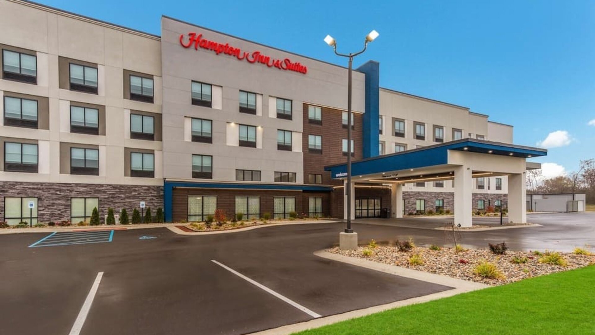 Hotel exterior and parking area at Hampton Inn & Suites Benton Harbor.