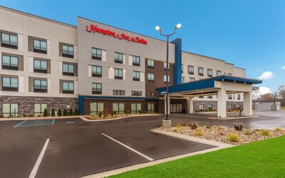 Hotel exterior and parking area at Hampton Inn & Suites Benton Harbor.