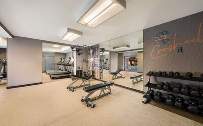 Fully equipped fitness center at Sonesta Select San Jose Airport.