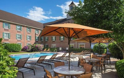 Outdoor pool and lounge area at Sonesta Select Boston Lowell Chelmsford.