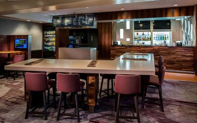 Dining area and workspace, perfect for coworking at Sonesta Select Boston Lowell Chelmsford.