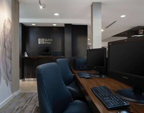 Business center with computers, printer and ergonomic chairs at Sonesta Select Chattanooga Hamilton Place.