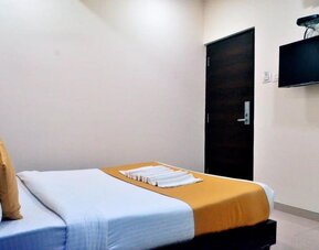 King room with TV and AC at THE BEST HOTEL MUMBAI.