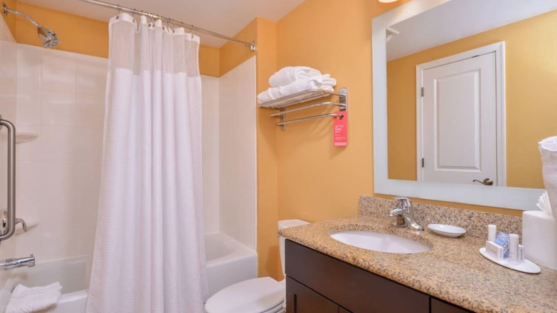 Guest bathroom with shower at Towneplace Suites By Marriott Arundel Mills.