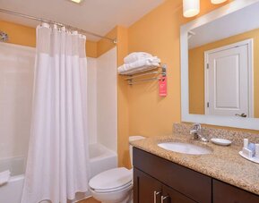 Guest bathroom with shower at Towneplace Suites By Marriott Arundel Mills.