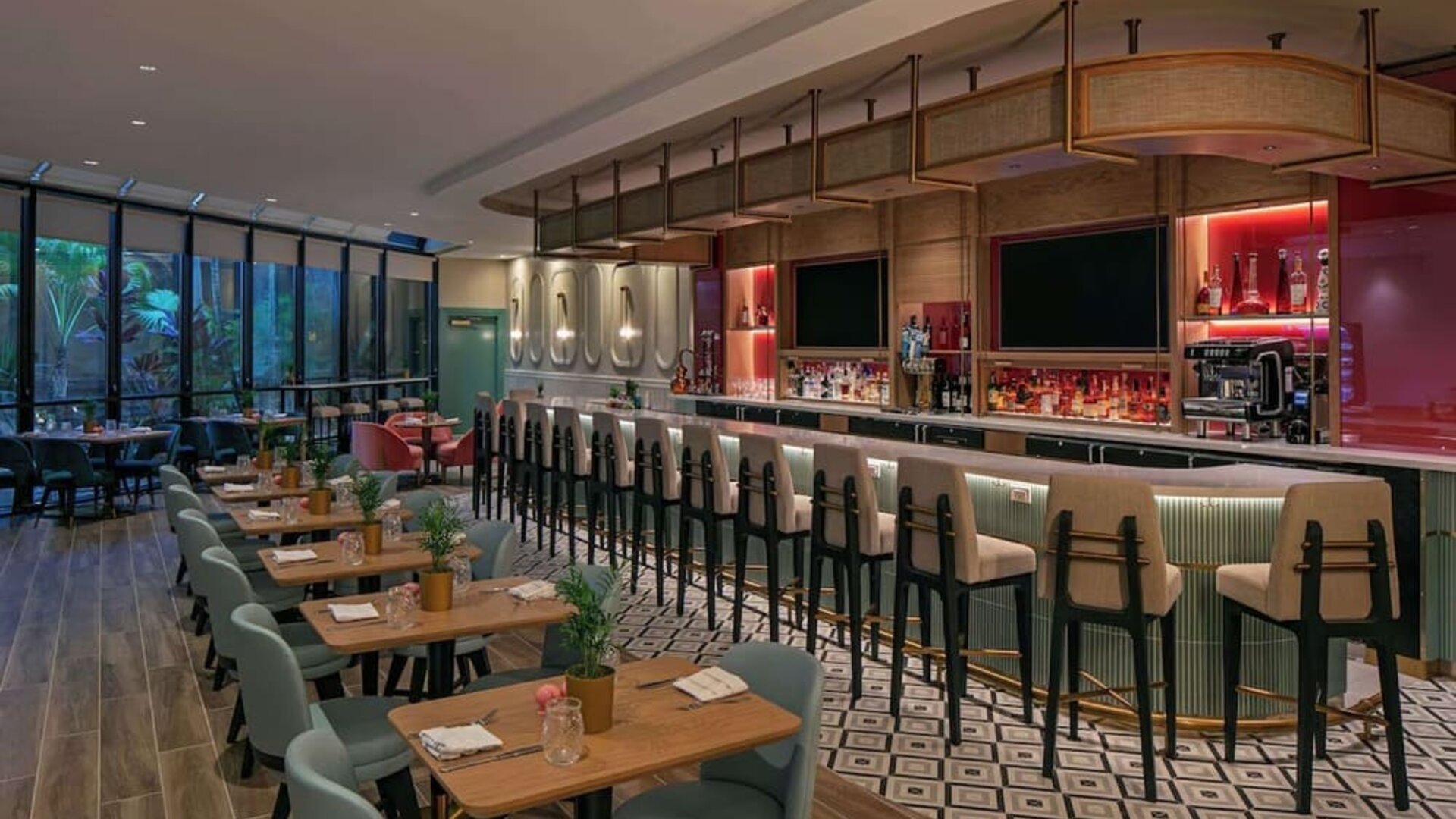 On-site bar with seating and lounge area at Sonesta Miami Airport.