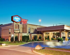 Hotel entrance and parking area at Hampton Inn Columbus-East. 
