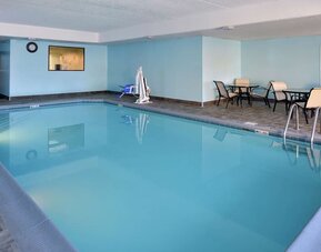 Indoor heated pool with lounge chairs at Hampton Inn Columbus-East.