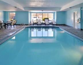 Relaxing indoor pool with lounge seating at Hampton Inn Columbus-East.