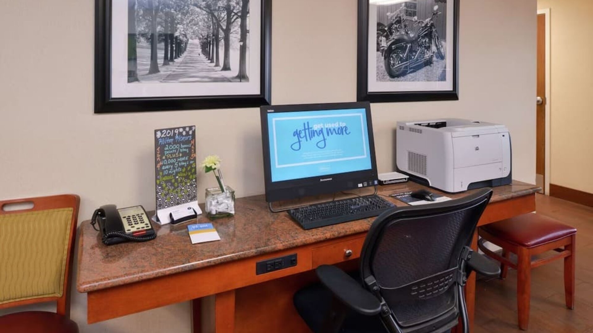 Business center with computer, printer and ergonomic chair at Hampton Inn Columbus-East.