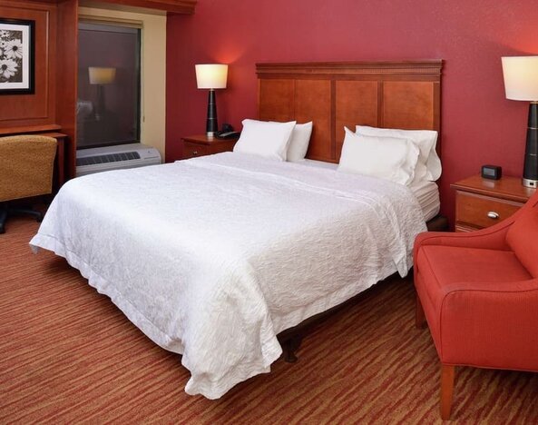 Day use room with work desk and sofa at Hampton Inn Columbus-East.