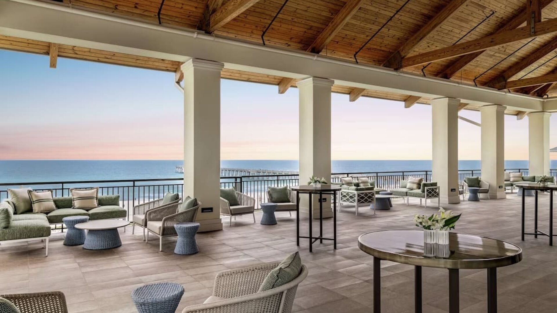 Lounge area at Embassy Suites By Hilton Panama City Beach Resort's terrace.