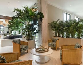 Comfortable lobby lounge area and workspace at Embassy Suites By Hilton Panama City Beach Resort.