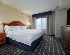 Standard day use room with TV screen and private bathroom at Hilton Garden Inn Milwaukee Northwest Conference Center.