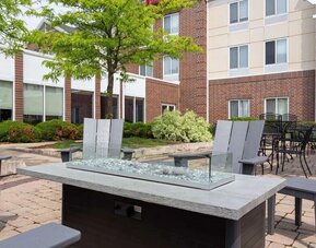 Hotel patio with lounge seating at Hilton Garden Inn Milwaukee Northwest Conference Center.