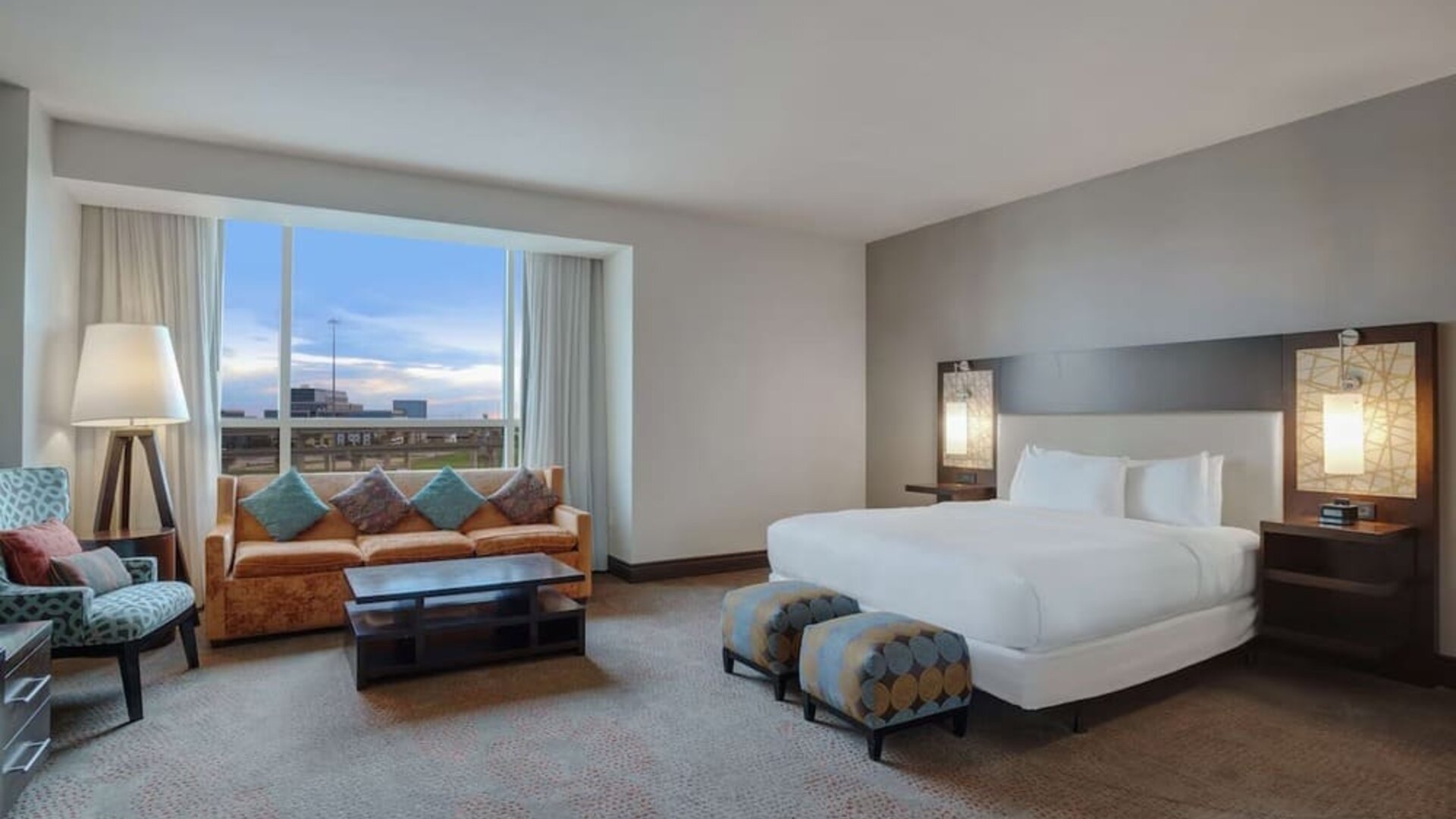 Spacious meeting room with living area at Hilton Dallas/ Plano Granite Park.

