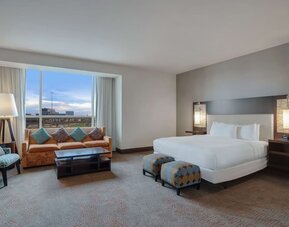 Spacious meeting room with living area at Hilton Dallas/ Plano Granite Park.
