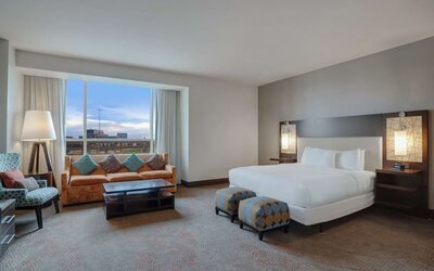 Spacious meeting room with living area at Hilton Dallas/ Plano Granite Park.
