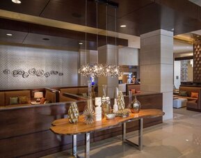 Lobby and coworking lounge at Hilton Dallas/ Plano Granite Park.