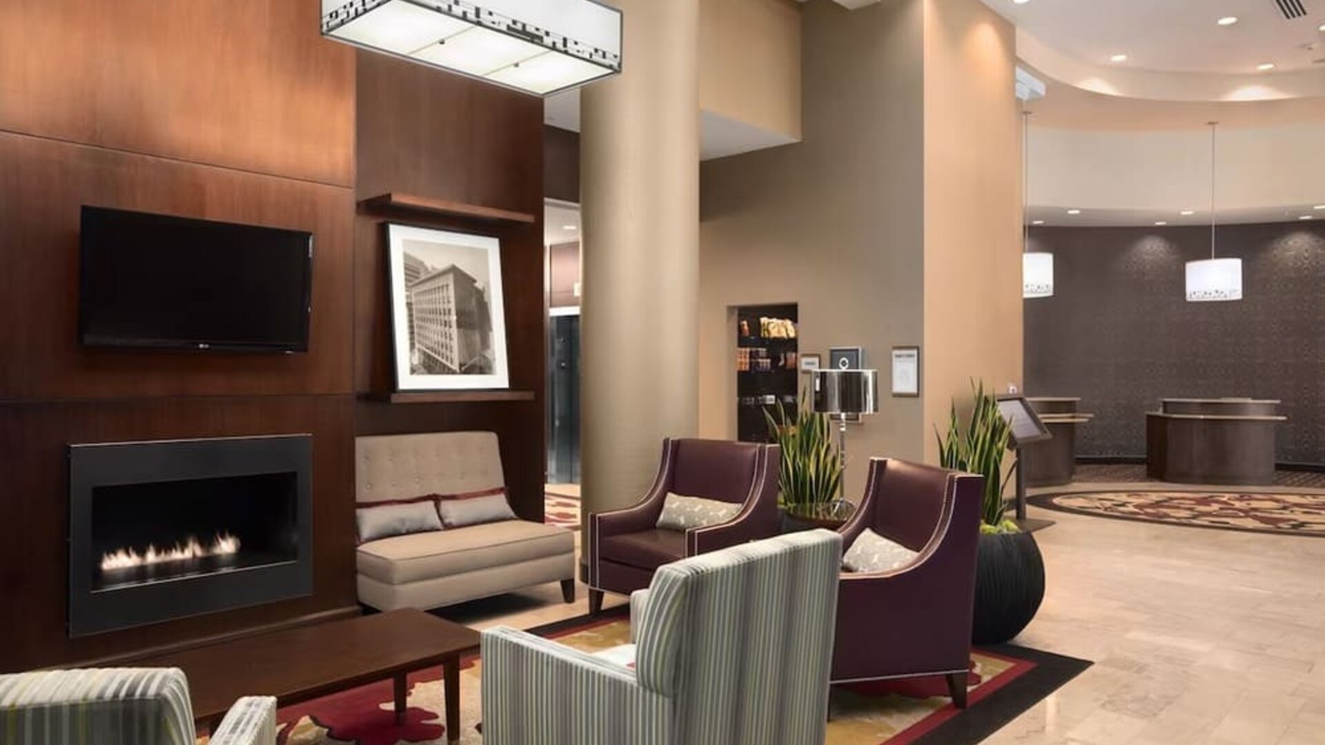 Lobby and coworking lounge at Embassy Suites By Hilton St. Louis Downtown.