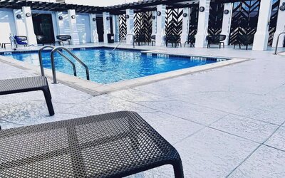 Refreshing outdoor pool at The Chifley Houston, Tapestry Collection By Hilton.
