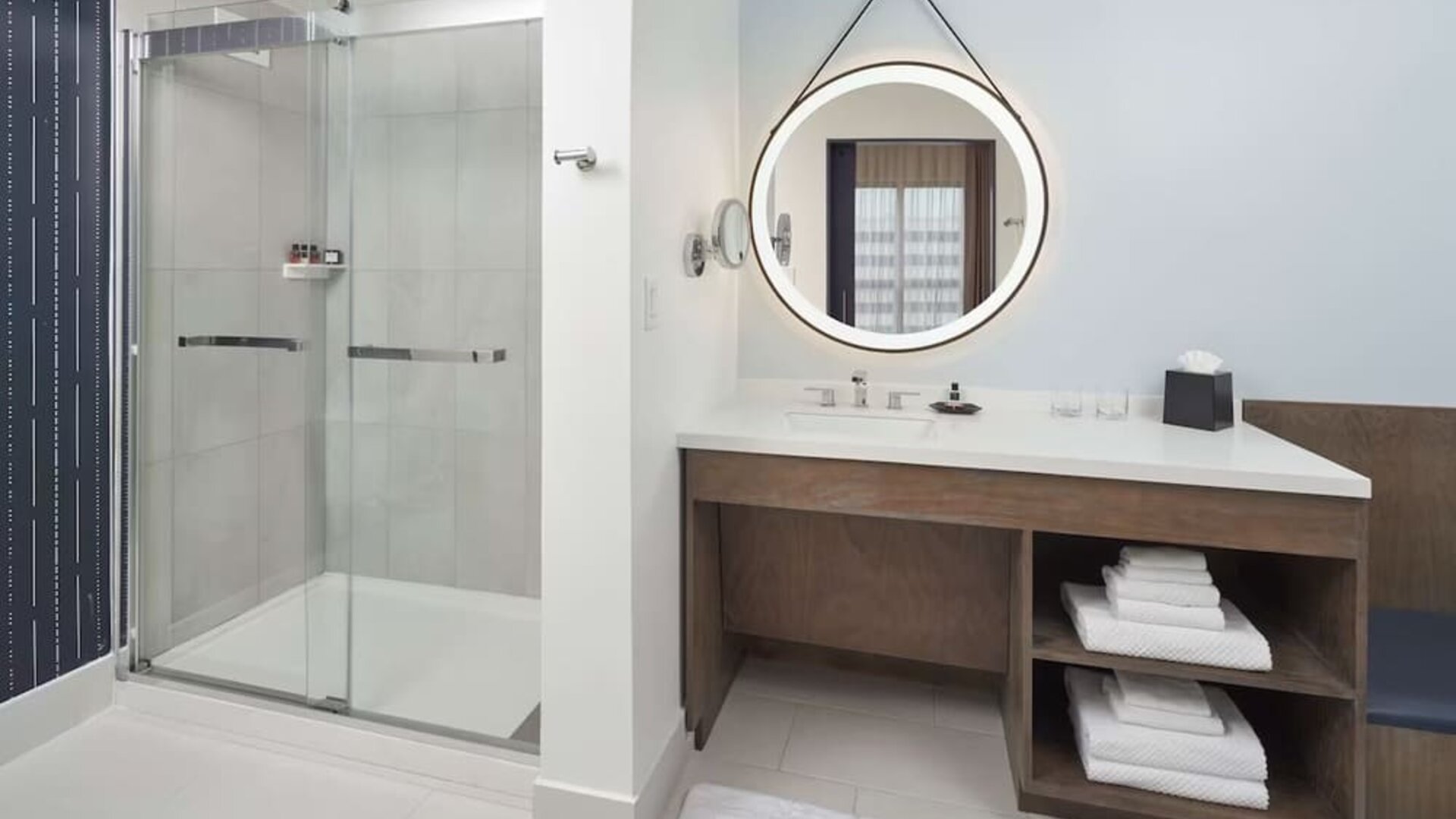 Guest bathroom with shower at The Chifley Houston, Tapestry Collection By Hilton.