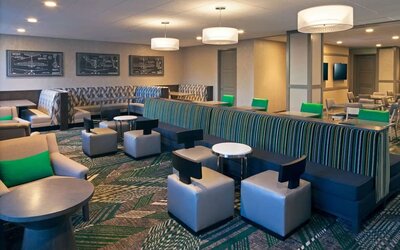 Coworking lounge at Homewood Suites By Hilton Los Angeles International Airport.