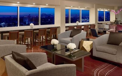Lobby lounge area and workspace at Royal Sonesta Houston Galleria.