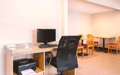 Business center with computer, printer and ergonomic chair at Hotel Inn Milwaukee.