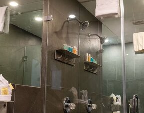 Private guest bathroom with shower and free toiletries at Hotel Chelsea, A South Beach Group Hotel.