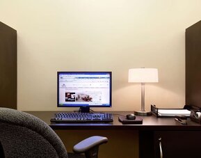 Business center with computer, printer and ergonomic chair at Hilton Orrington/Evanston.