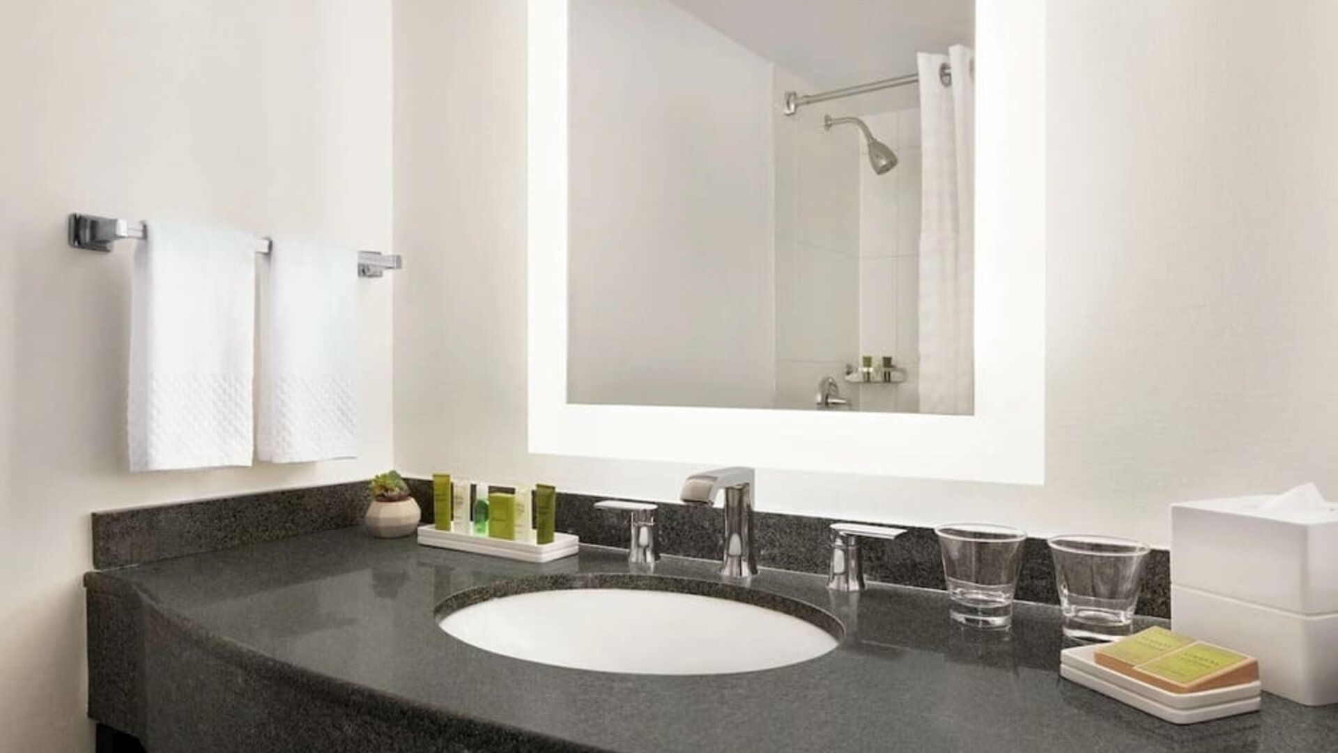 Private guest bathroom with shower and free toiletries at Hilton Scottsdale Resort & Villas.