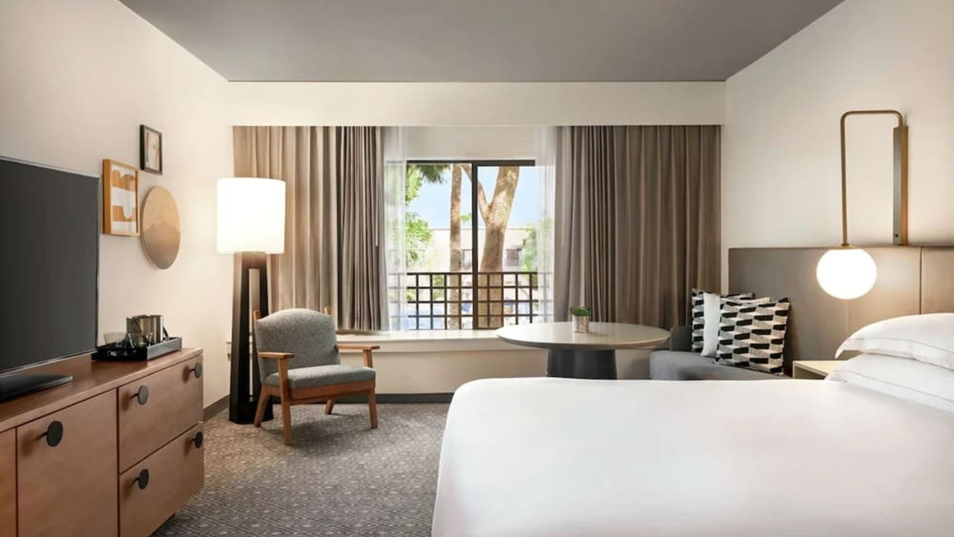 Day use room with workspace and TV screen at Hilton Scottsdale Resort & Villas.