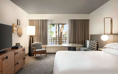 Day use room with workspace and TV screen at Hilton Scottsdale Resort & Villas.