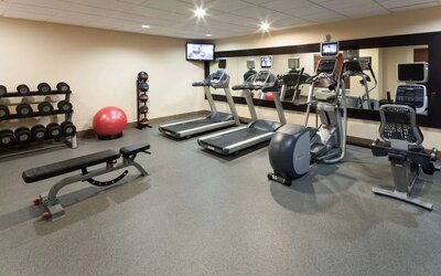 Fully equipped fitness center at Homewood Suites By Hilton Agoura Hills.