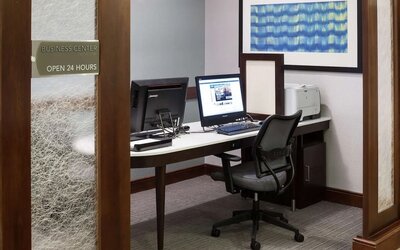 Business center with computers, printer and ergonomic chairs at Homewood Suites By Hilton Agoura Hills.
